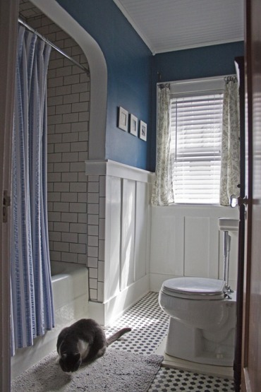 The addition of board and batten panels and a saturated blue (BM Blue Danube) added some snap to the bathroom. 