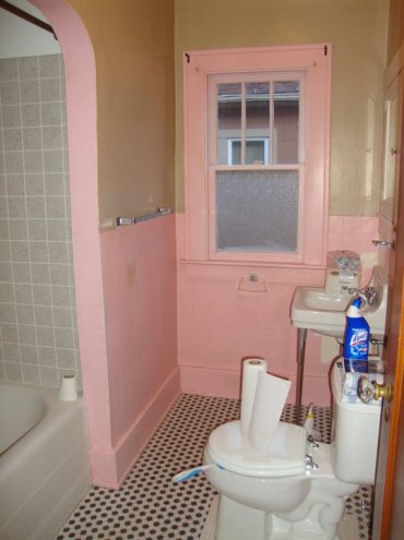Bathroom Before: Pink trim and walls detracted from the orginal features like the hex tile floor. 